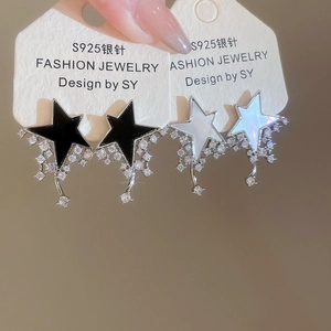 Detail of star-shaped earrings with zircon tassels and S925 silver needles in black and white