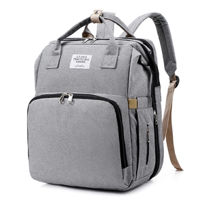 Detail view of the grey multi-functional diaper backpack with durable fabric and broad straps