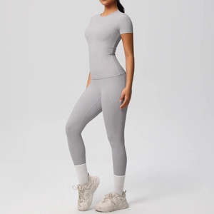 Detail of light gray yoga set featuring side pocket on high-waist pants and slim t-shirt