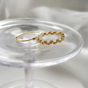 French minimalist gold rings set featuring pearl accents and geometric textured design