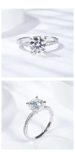 Close-up of a 7.5mm round moissanite ring with side accent diamonds and filigree detailing