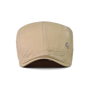 Detail of khaki cotton flat cap featuring POLO embroidery and a small metal horse logo
