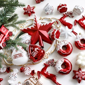 Red and white Christmas ornament set with stars and donuts on festive background