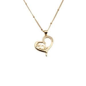 Close-up of golden heart pendant with MOM lettering and inlaid small zircon stones