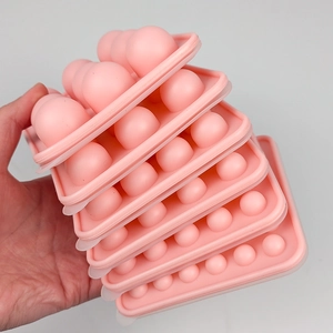 Pink food-grade silicone ice ball mold set with stackable design for round ice cubes