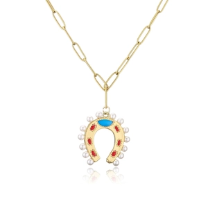 Detail of horseshoe pendant with pearls and colorful enamel on a gold chain