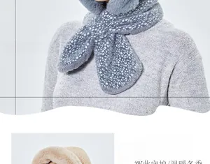 Detail of plush winter hooded scarf with ears in light grey polka dot and beige faux fur