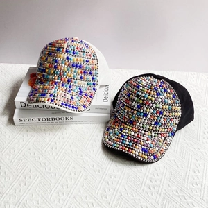 Fashionable black and white baseball caps with colorful pearls and rhinestones details