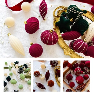 Velvet Christmas ornaments in assorted shapes and colors with gold glitter details