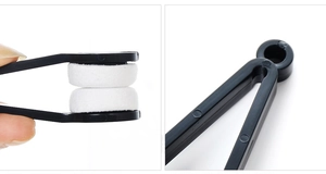 Close-up of portable eyeglasses cleaner tool showing microfiber pads and V-shaped handle