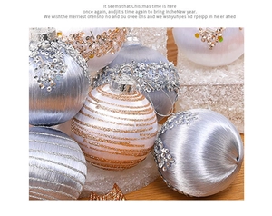 Close-up of glittered silver and white Christmas foam balls with striped textures