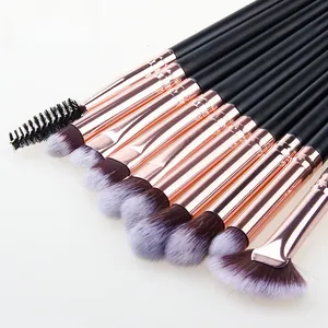 Close-up of 12 makeup brushes with rose gold ferrules and purple gradient fiber bristles