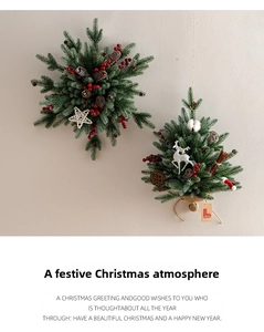 Close-up of snowflake and pine tree wall hangings with pine cones and red berries