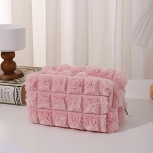 Close-up of pink plush pencil case with mesh texture and premium metal zipper detail