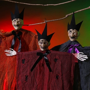 Close-up of hanging Halloween ghosts in orange, red and black robes with skull hands