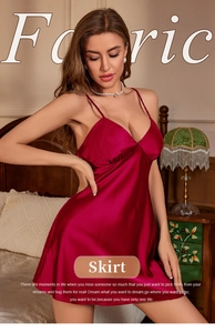 Detail of red satin slip dress showing silk texture and delicate V-neckline design
