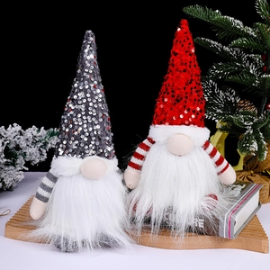Christmas gnomes set with sequins hats and white beards on a festive wooden tray decor
