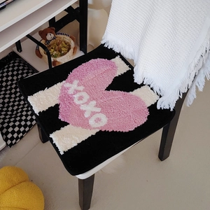 Plush black square chair cushion with pink heart and XOXO pattern for home decor