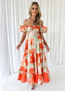 Detail view of floral off-shoulder dress with puff sleeves and layered tiered skirt