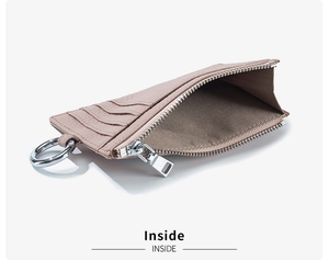 Macro shot of litchi grain leather coin purse interior with zipper and card slots
