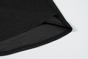 Close-up of black satin dress hem with fine stitching and smooth fabric texture