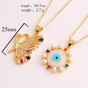 Detail showing colorful zircon butterfly and evil eye pendants with dimensions and weight