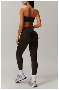 Detail of high-waisted gray leggings with scrunch butt design and black tube top set