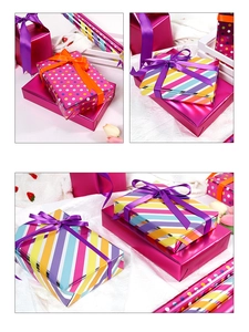 Close-up of colorful striped and polka dot gift wrap with shiny metallic finish and ribbons