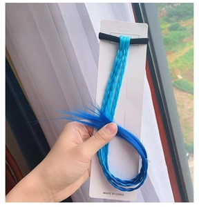 Detail of sky blue gradient to royal blue braided hair extension with elastic band