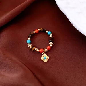 Vintage beaded stretch ring with tiger eye stone, turquoise beads and golden floral charm