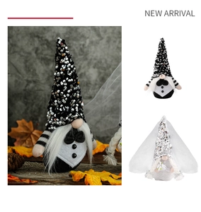 Detail of bride and groom wedding gnomes featuring sequin hats and white lace veil