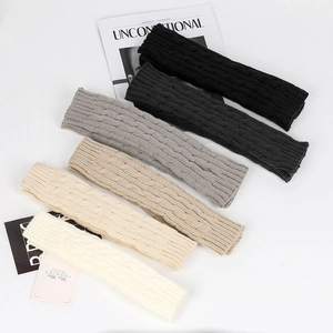 Detailed knit texture of five colors cable knit fingerless gloves with ribbed cuffs