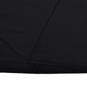 Macro shot of precise stitching and premium black fabric texture on the dress hemline