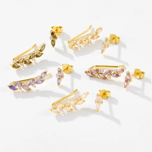 Detail of 925 sterling silver earrings with colorful marquise zircons and gold plating