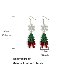 Christmas acrylic drop earrings with snowflake and green tree charms on a white background