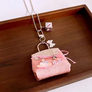 Pink cat-themed mini bag pendant necklace in premium titanium steel with leather texture