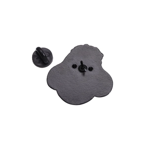 Detail showing the black metal pin back with rubber clutch on a white background