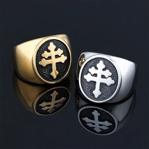 Vintage stainless steel ring set in gold and silver featuring Lorraine cross relief design