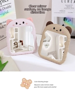 Detail of cute bear ear desktop makeup mirror with foldable stand in macaron colors