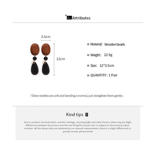 Detailed size and weight specifications for these oval wood bead drop earrings