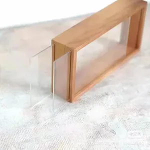 Macro detail of the dual-track wooden frame for dried flower specimens and art display