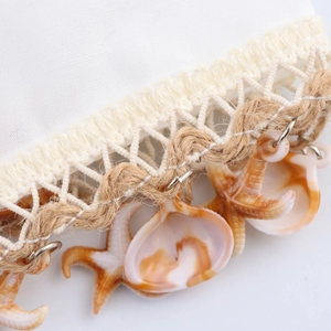 Solid color beach dress featuring seaside shell and starfish chain strap details
