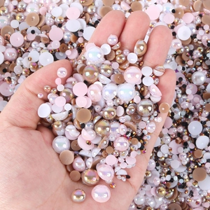 Detailed close-up of mixed colorful resin half-round pearls and rhinestones for nail art DIY
