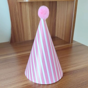 Pink and white striped cone party hat with a fluffy pom-pom for kids birthday celebration