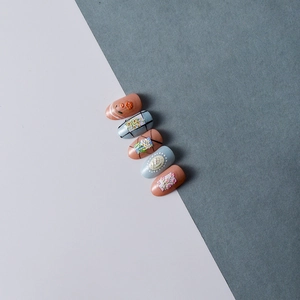 5D embossed press-on nails featuring vintage floral patterns in peach and blue colors