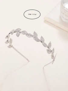 Detail view of Baroque silver leaf headband showing intricate texture and metal engraving