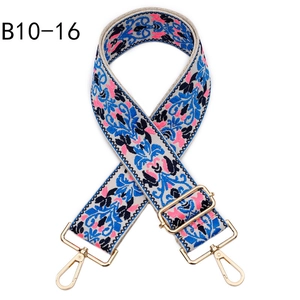 Close-up of bohemian jacquard woven bag strap with golden metal lobster clasps