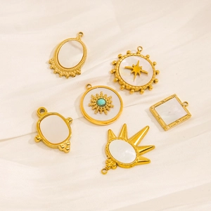 Set of six gold celestial pendants with mother-of-pearl and star patterns on silk
