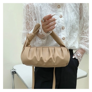 Detailed view of the khaki ruched cloud bag featuring stylish knot detail on handle