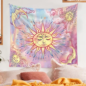 Detail of bohemian celestial tapestry with sun and moon over a cozy bedroom bed